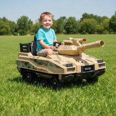Child playing with a toy tank rideon car in a grassy outdoor area