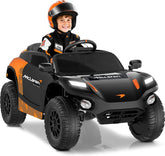 Child in a McLaren toy car with a helmet