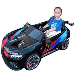 Child sitting in M8 GTE Style Racing 24V Electric Car for Kids