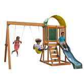 Children playing on a wooden swing and slide wooden playset by kidkraft