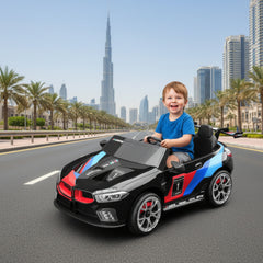 Kid in M8 GTE Style Racing Electric Ride-On Car for Kids with a cityscape