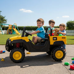 Three children playing with Caterpillar Dump Truck