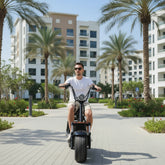 Man riding a Kugoo City Coco Electric Scooter 60V Lithium Battery 2-Wheel E Bike for Adults