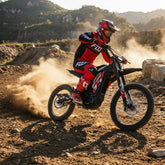 adult riding a electric dirt bike on a rocky trail