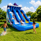 Children playing on an inflatable water slide in a park