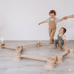 Two children playing with a Wooden Balance Beam for Kids Indoor Playset