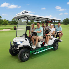 A group of people in a golf cart on a golf course