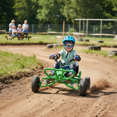 Young child wearing safety gear driving Rage Go Kart on dirt track