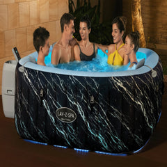 Family in an inflatable hot tub with Lay-Z-Spa