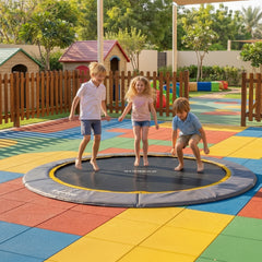 Children playing on a KIDDORO 10FT In-Ground Trampoline in a play area.