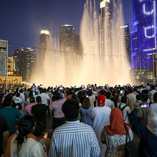 Huge crowd during Eid Al Adha celebrations at Dubai mall fountain area.