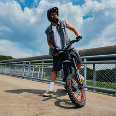 Person with a Viper S Electric Cross Bike on a bridge 