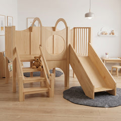 Customised wooden kids' playset with a loft  ladder stairs, circular slide, and attached slide