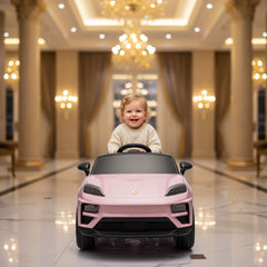 Child in a pink toy car in an elegant indoor