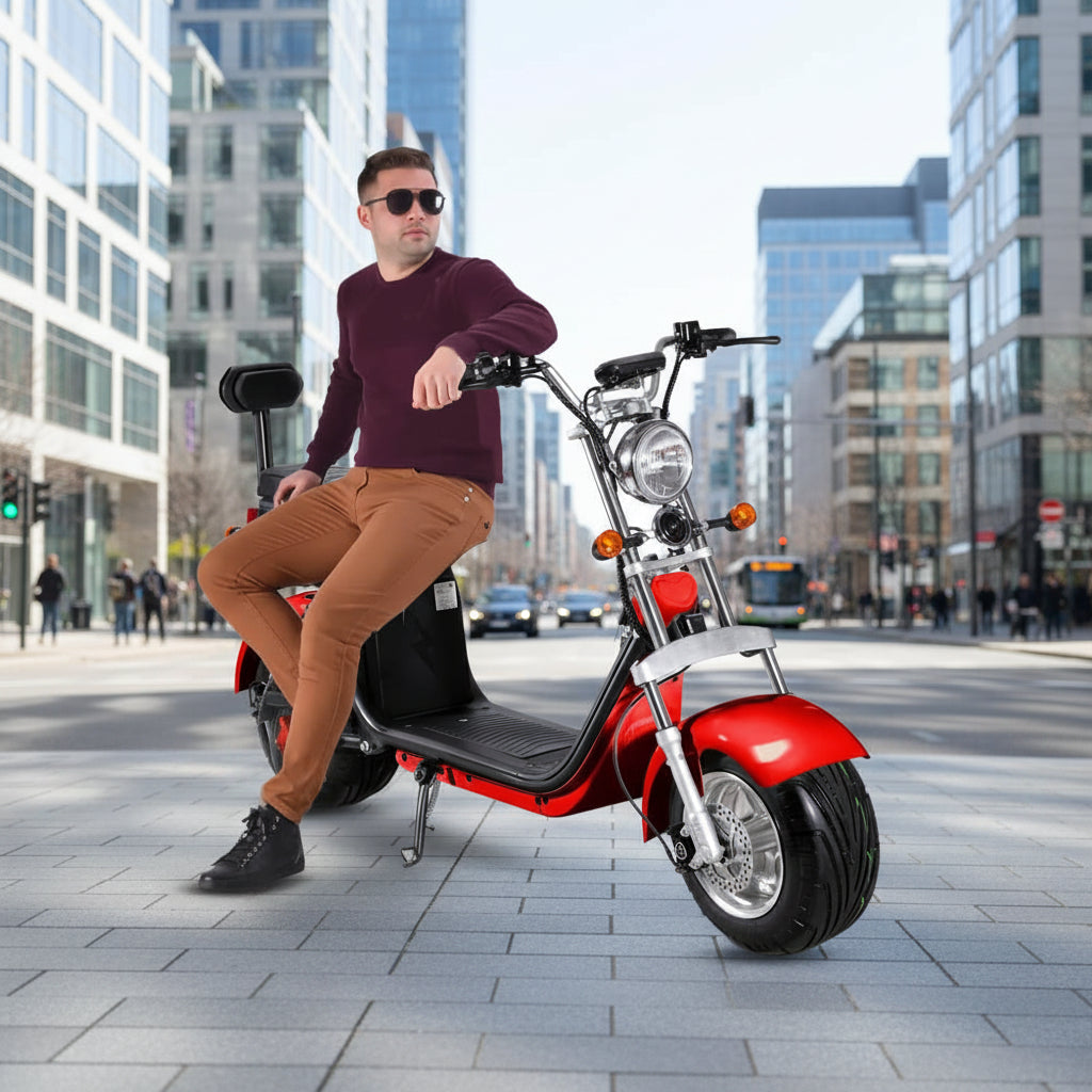 Man sitting on a red electric scooter