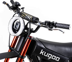 Close-up of a Kugoo electric bike with handlebars and headlight
