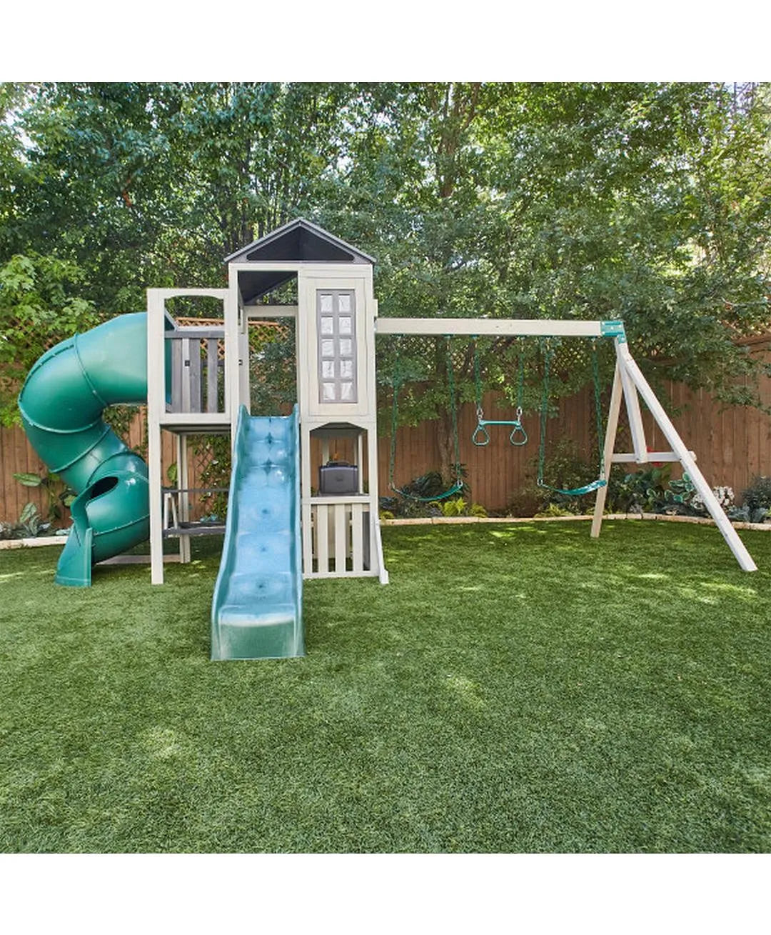 Kidkraft Wrangler  Children's playset with slides and swings on a grassy area