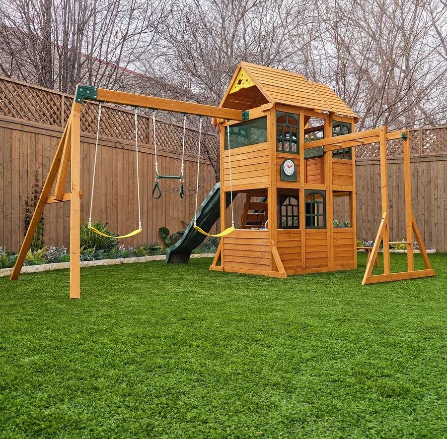 Kidkraft Overland Heights  Wooden playset with swings and slide on a grassy lawn