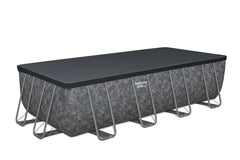Rectangular above-ground pool with black cover 