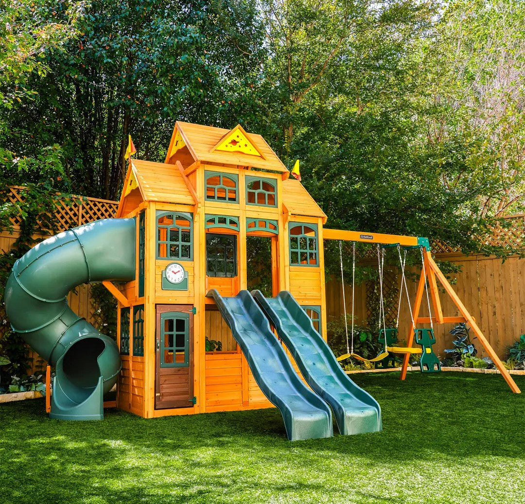 KidKraft Falcon Ridge Wooden Swing Set and Playset with Kitchen  in a backyard setting.