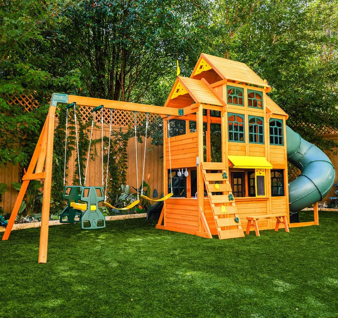 KidKraft Falcon Ridge Wooden Swing Set and Playset with Kitchen in a backyard.