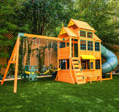 KidKraft Falcon Ridge Wooden Swing Set and Playset with Kitchen in a backyard.