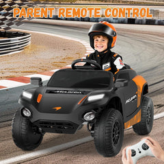 Child driving a McLaren toy car on a racetrack with a parent holding a remote control