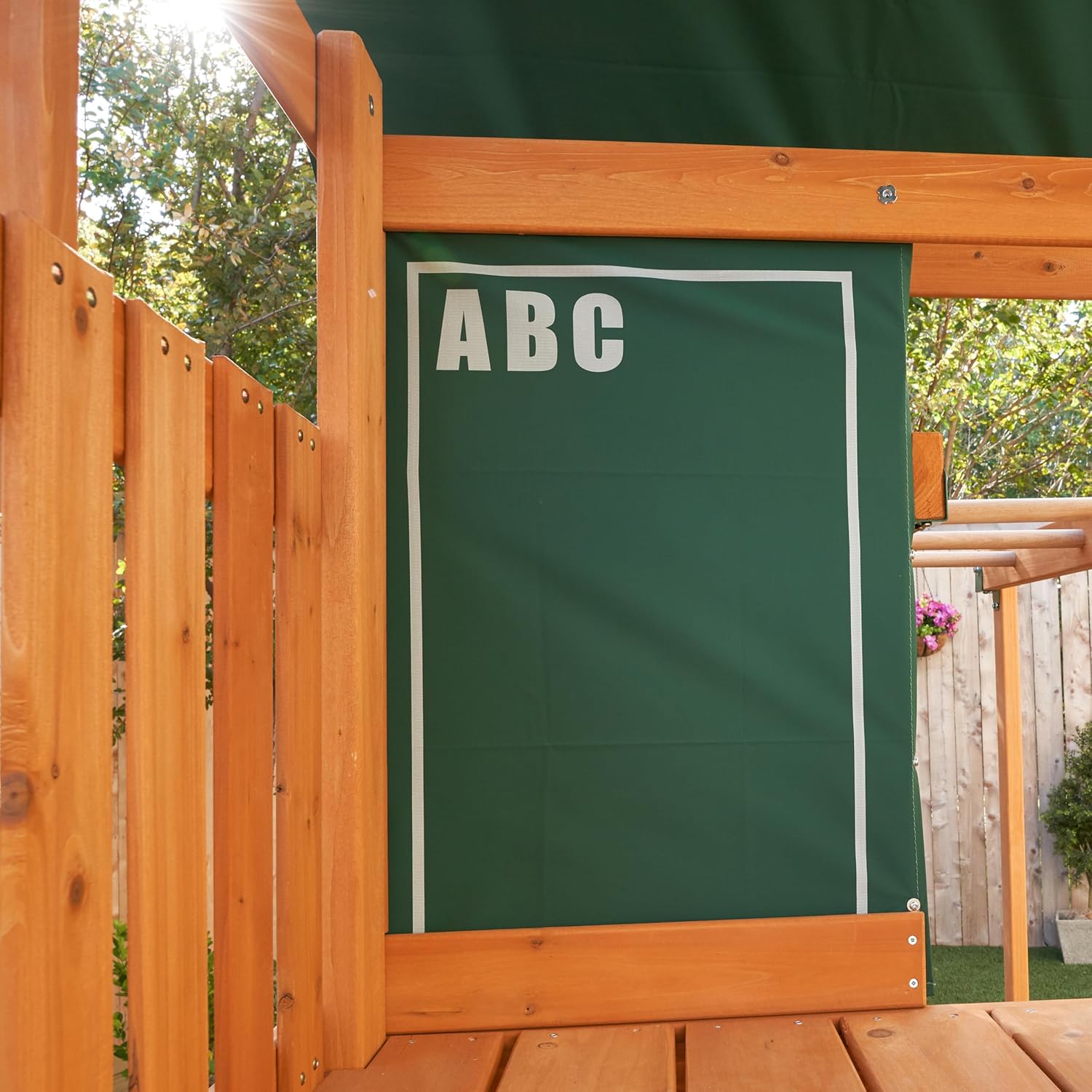 Kidkraft Brightside Wooden playhouse with a green chalkboard.
