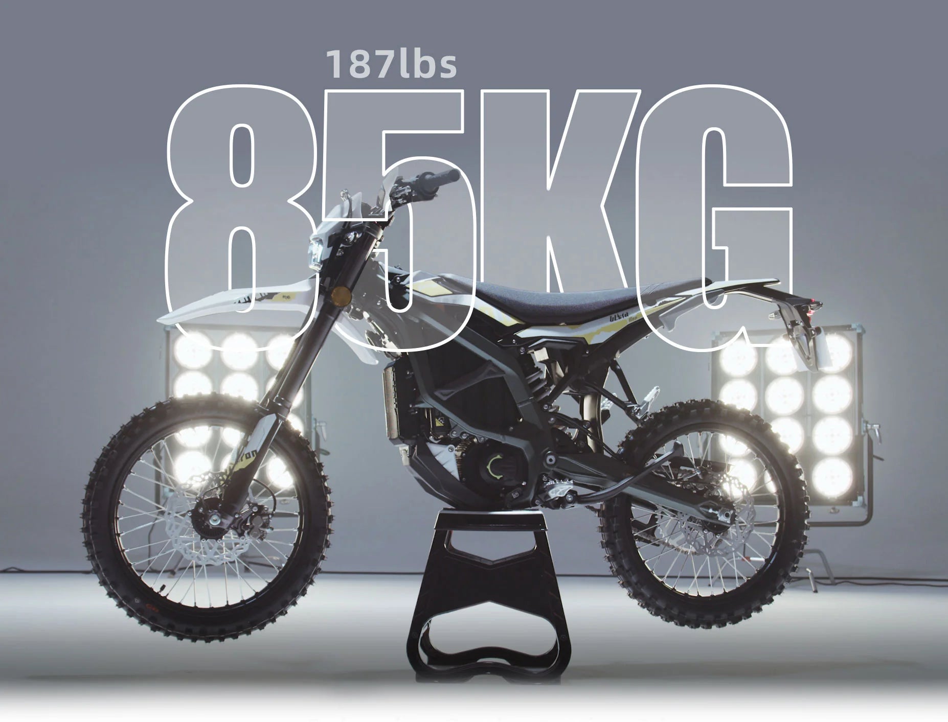 Surron Ultra BEE Electric off-road dirt bike stand with weight information displayed