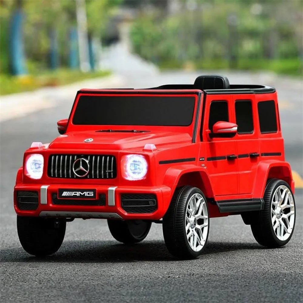 Red toy car, a Mercedes-Benz AMG model on a road 