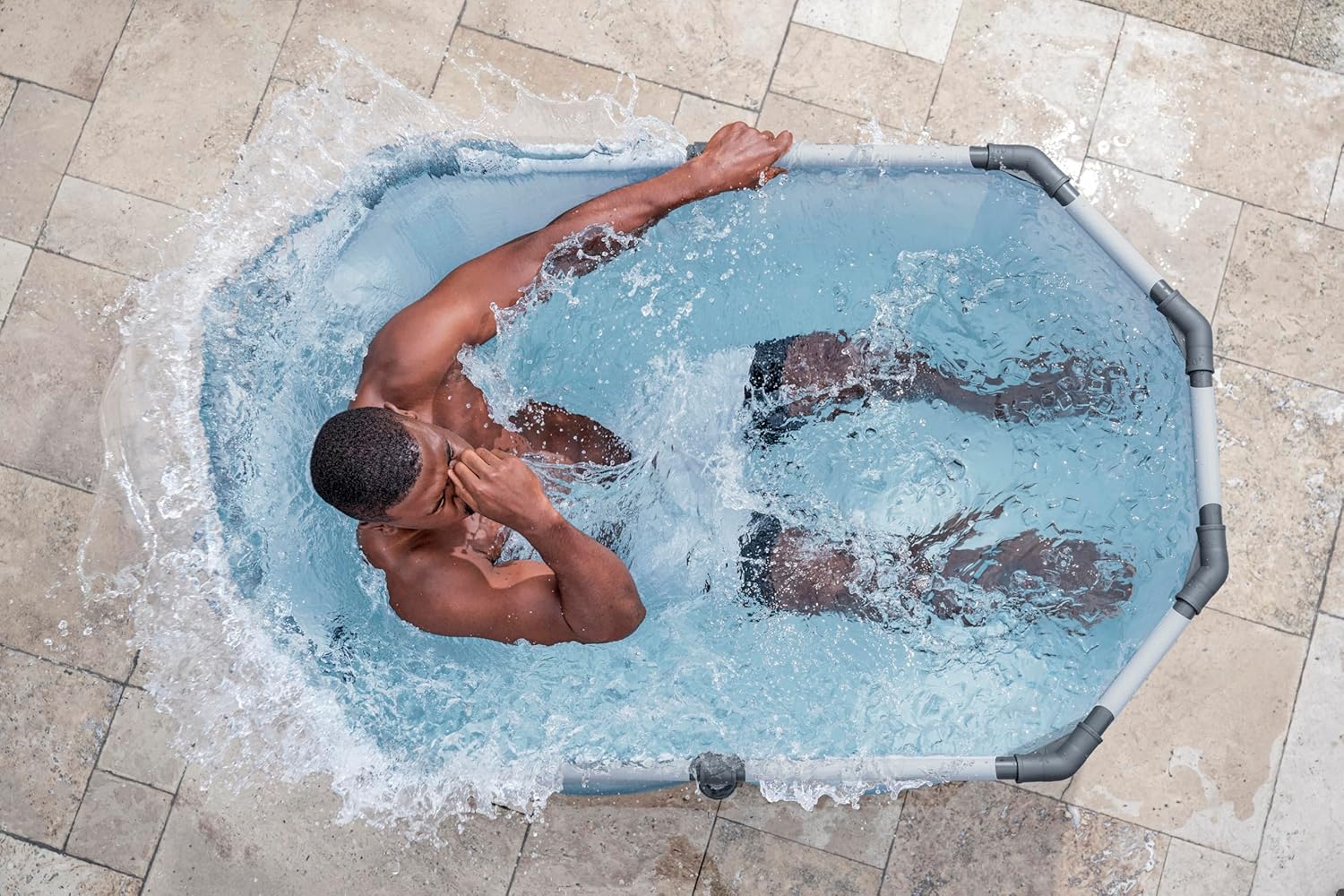 Person relaxing in a portable Ice tub