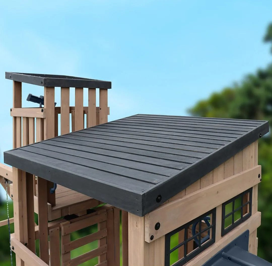 Gorilla Playsets Skyline Lookout Wooden playhouse with a gray roof and climbing structure.