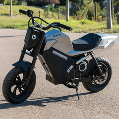 Small Kids electric motorcycle on a paved road 