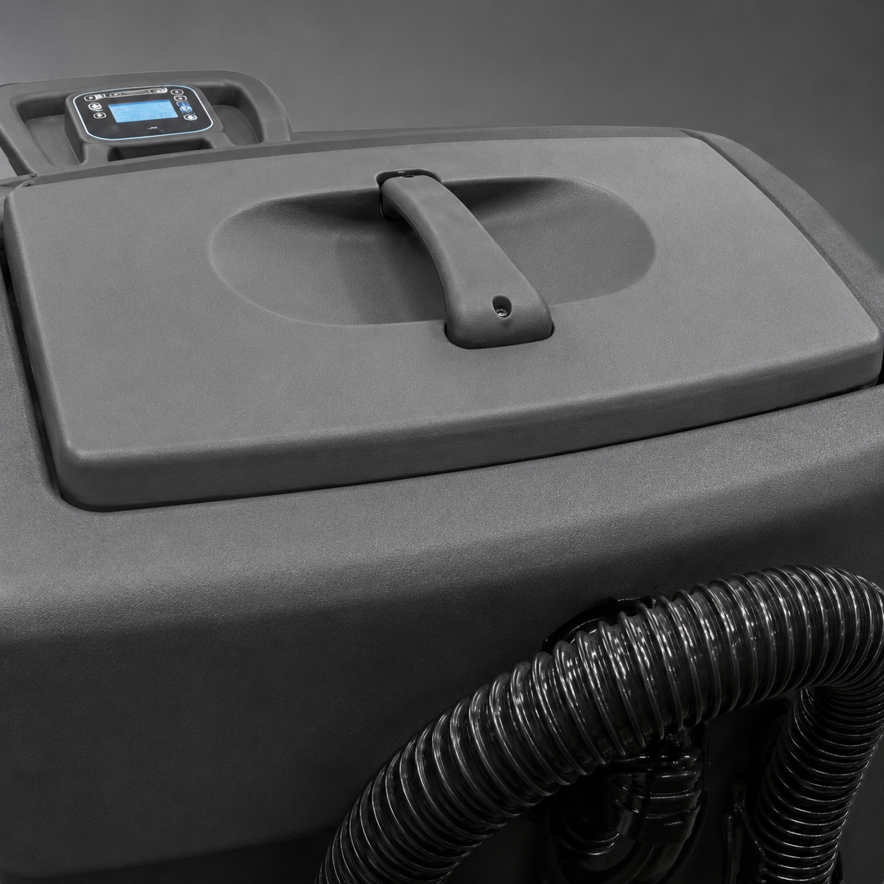 Close-up of a grey BRAVO 3250 Scrubber Drier lid with a handle and a small digital display,