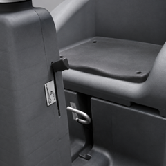 Close-up of a dark grey plastic seat