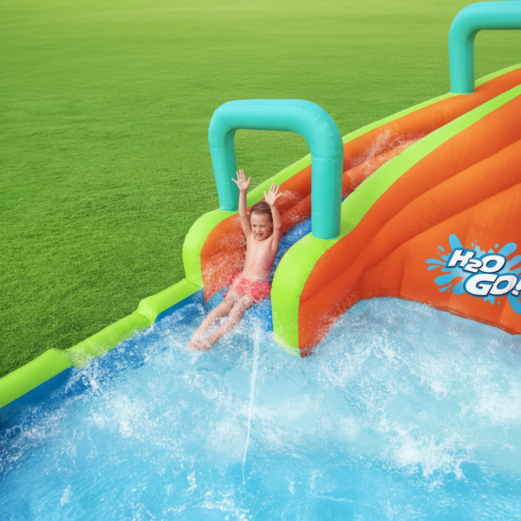 Inflatable water slide with a child sliding down into a water pool