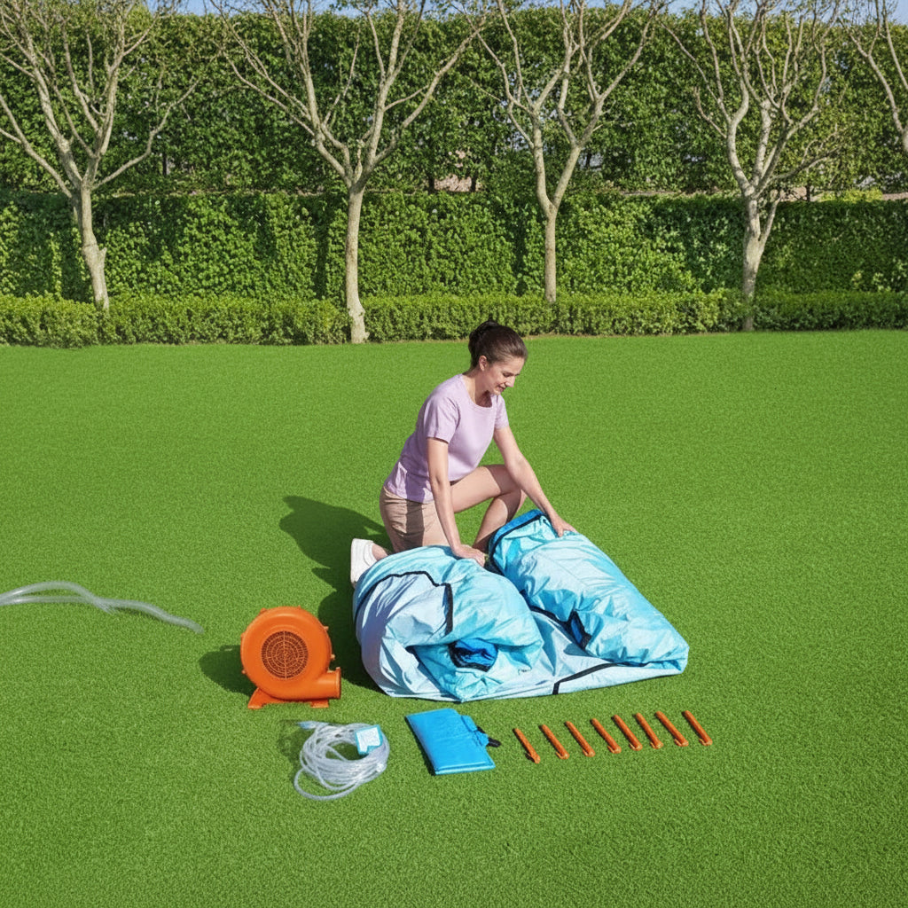 Person setting up outdoor equipment on a grassy area
