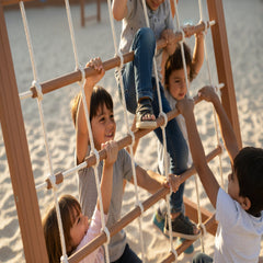 Children playing on a playground with sand
