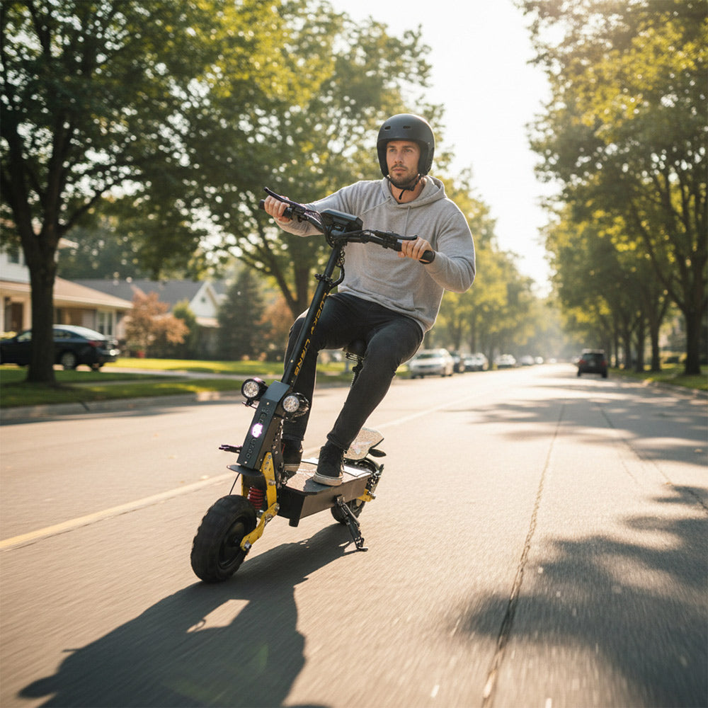 A man riding an electric scooter on a sunny suburban street