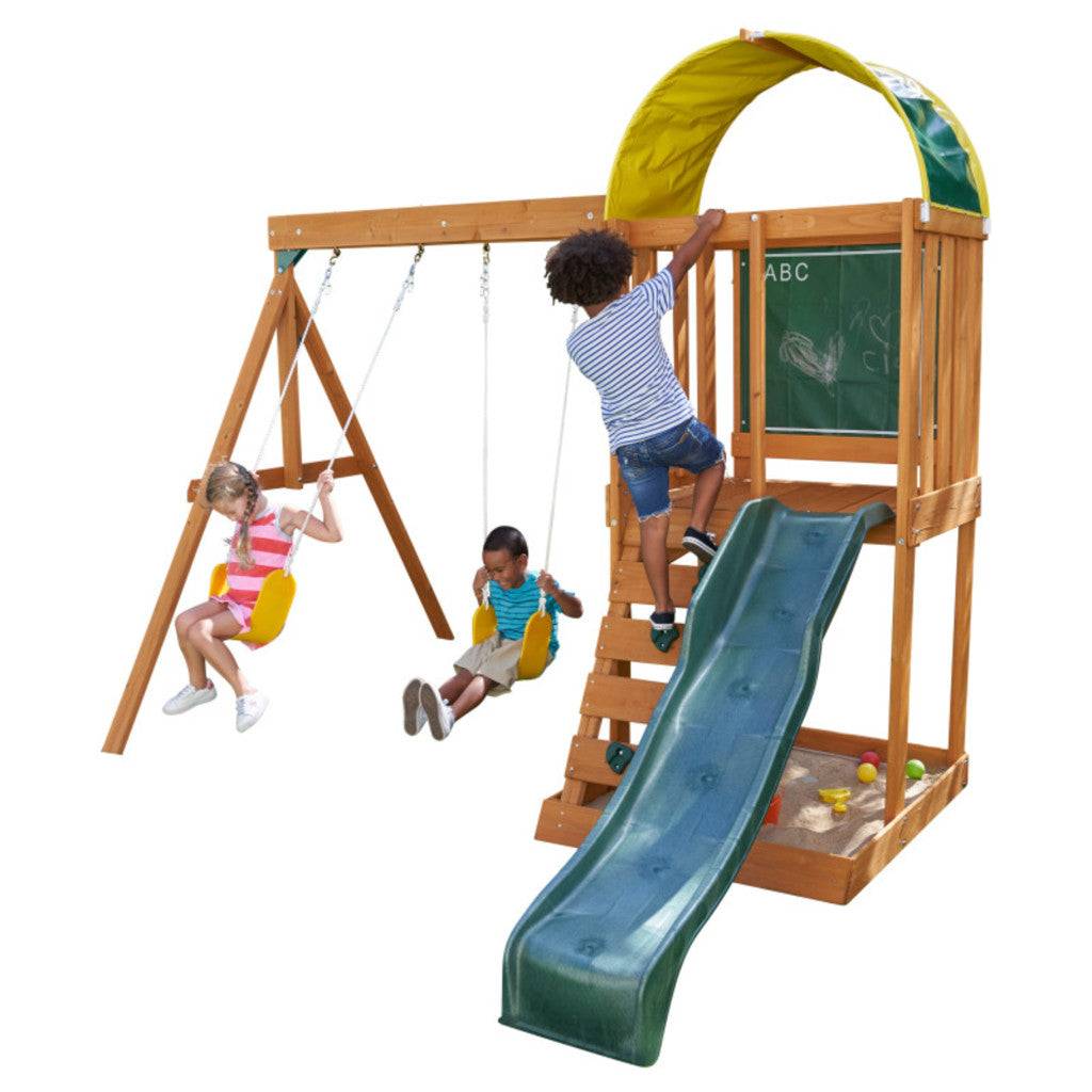 Kidkraft Ainsley Outdoor Playset Children playing on a swing set with a slide and climbing Green structure.