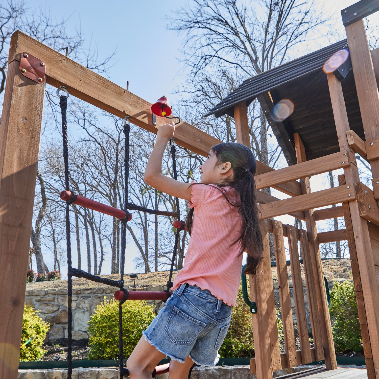 Treetop Observatory Wooden Swing and Slide climbing girl.