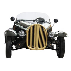 Front view of a vintage car with gold grille