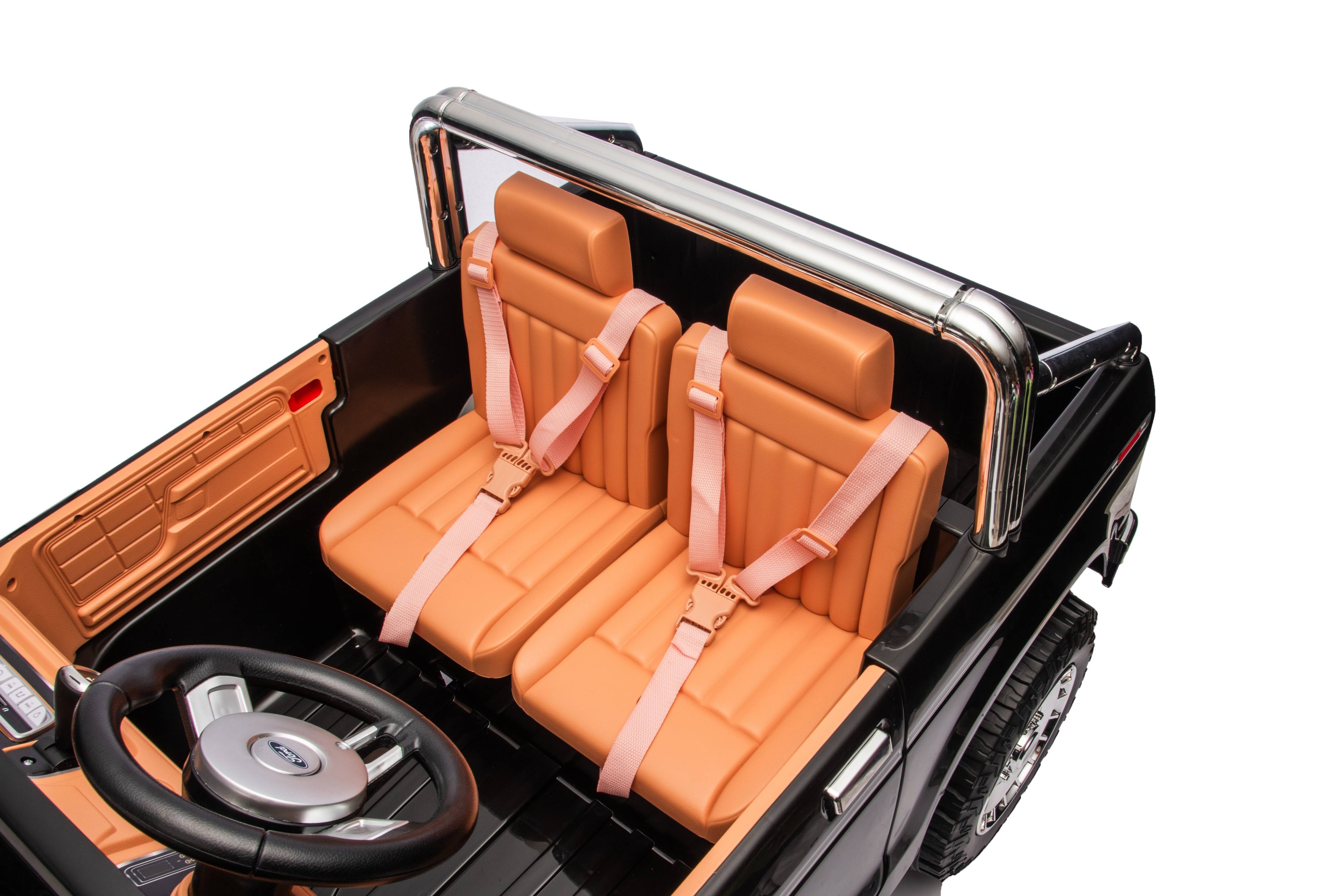 Children's toy car with Orange Leather  seats and a black steering wheel