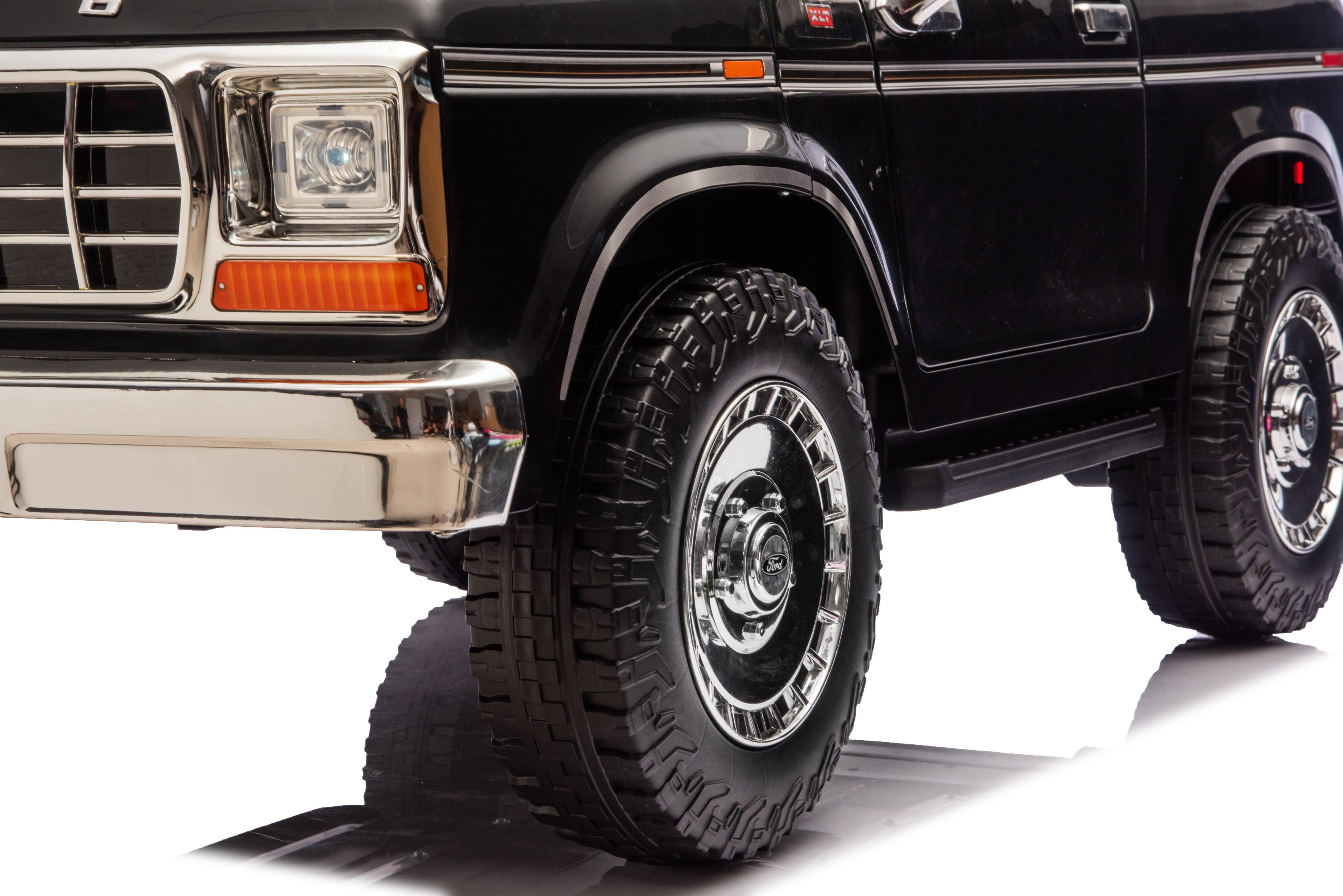 Close-up of a black SUV Car with large off-road tyres