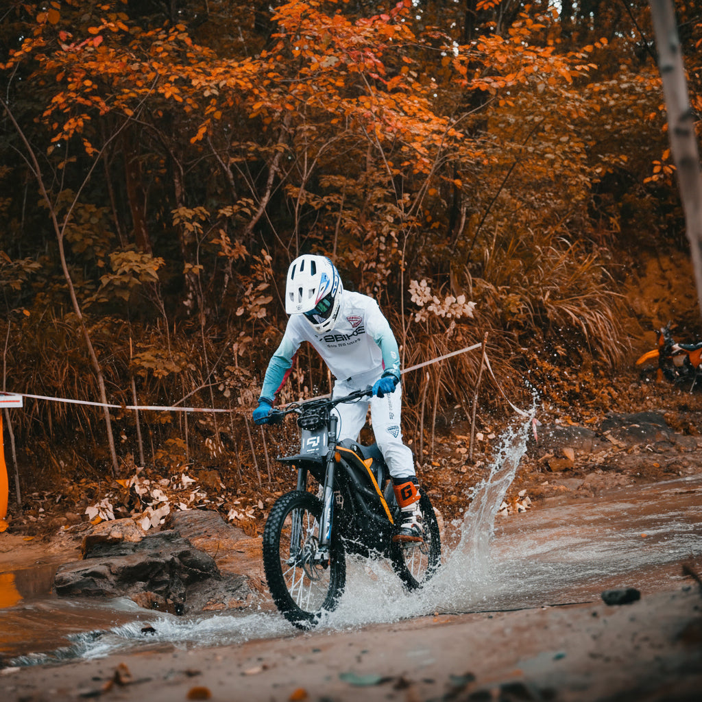 Biker crossing a stream on a 79BIKE-Falcon Pro Electric Dirt Bike in a forest setting