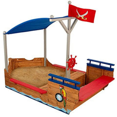 Children's pirate ship playset with sand area, canopy, and flags