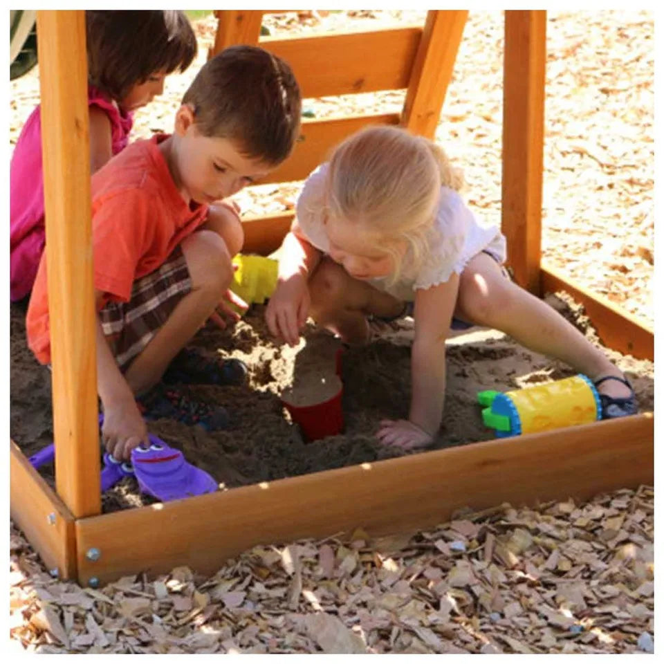 Kidkraft Ainsley Outdoor Playset Children playing in a sandbox.