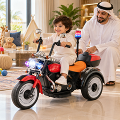 A young child enjoying the Megastar Children’s Electric Ride On Police Tricycle in a spacious indoor play area