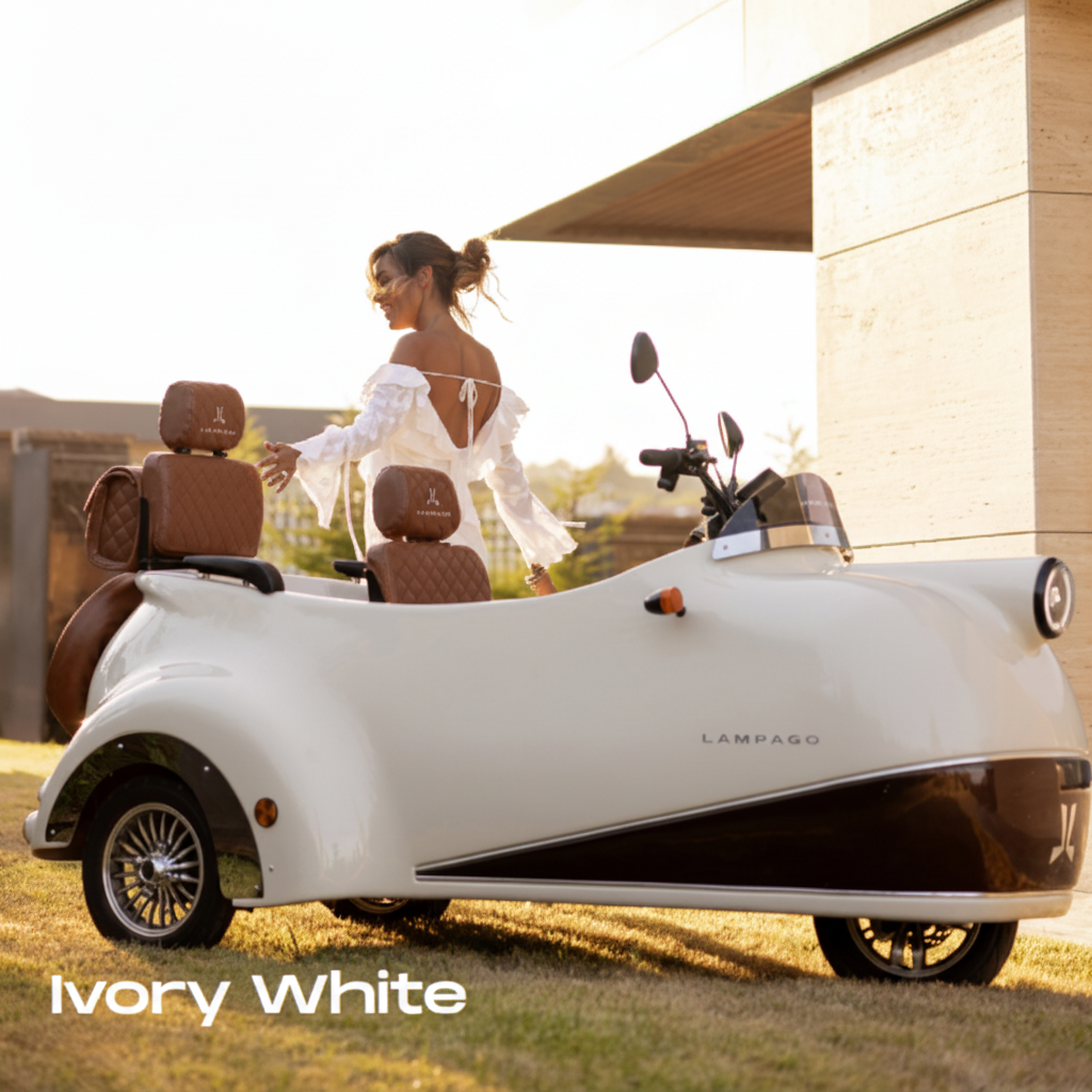 A 3-wheeled luxury electric Scooter in ivory white with brown leather seats