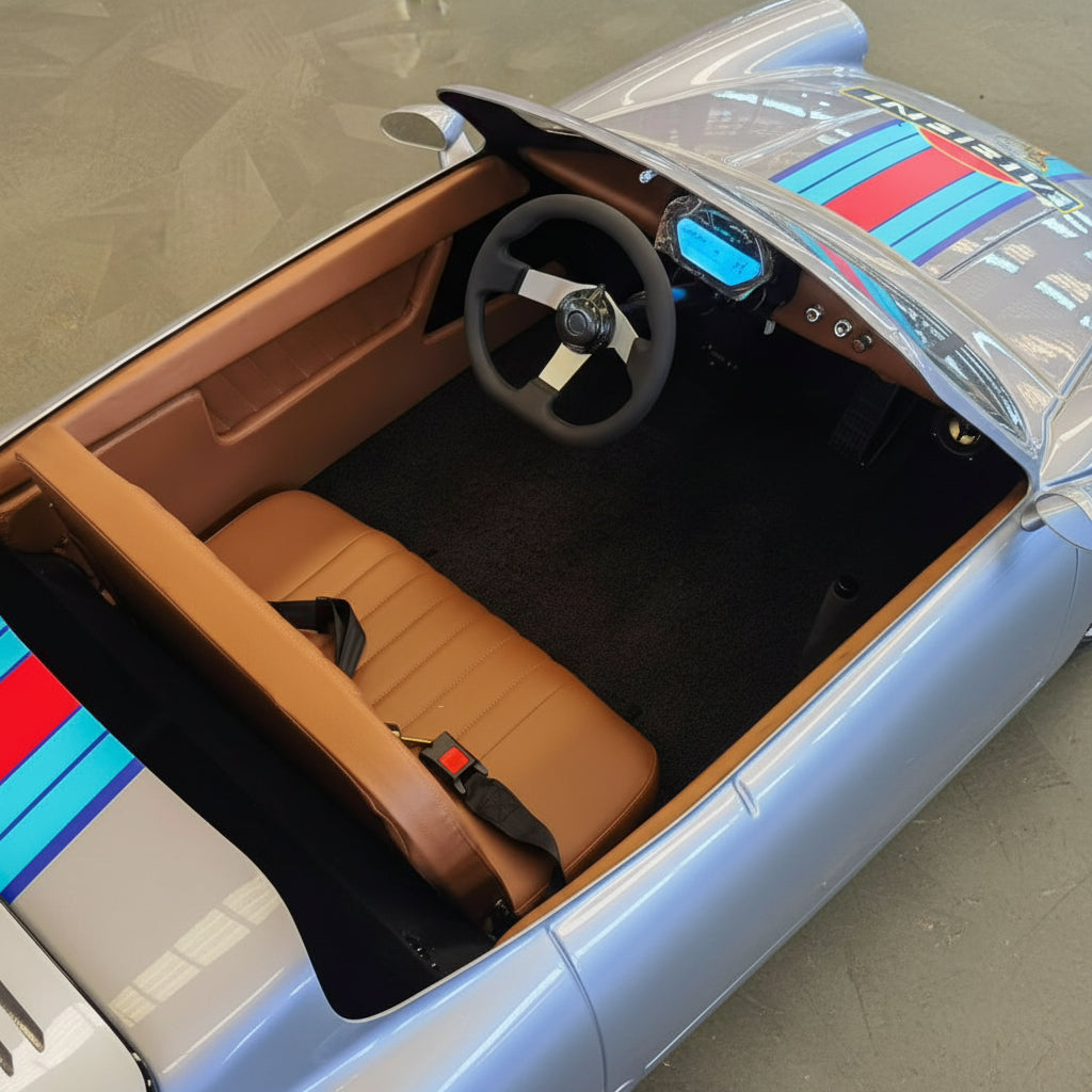 Top-down view of a Mini Porsche Martini Edition Electric Drift Go Kart interior with tan bucket seats, a black steering wheel